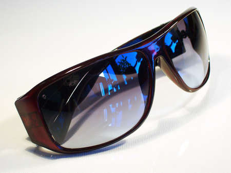 A pair of cool trendy sunglasses isolated against a white background