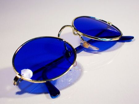 A pair of cool trendy sunglasses isolated against a white backgroundの写真素材