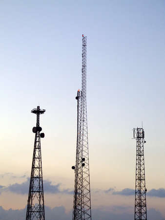 Communications mast silhouetted against the African sky just before sunrise