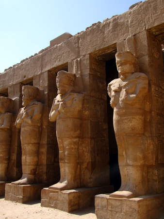 ancient statues in the karnak temple complex at luxor in Egypt.