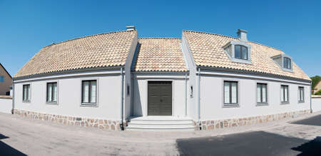 A panoramic image of an old renovated house in the swedish town of Torekov.の写真素材