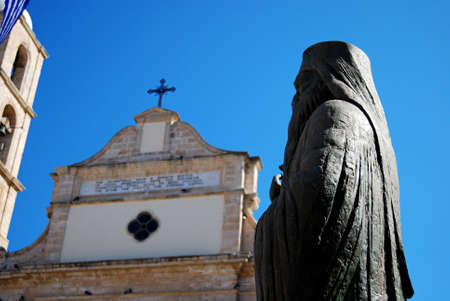 A statue outside of a monastery in Chania on the Greek island of Crete.の写真素材