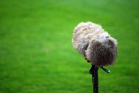 A large microphone boom for tv or radio situated at a football match.の写真素材