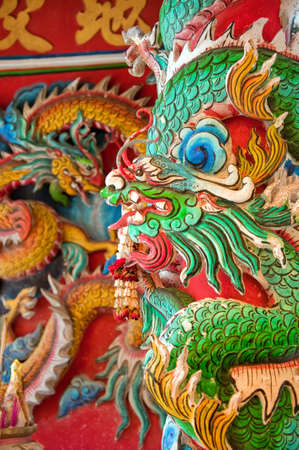 Colorful and intricate carving from a chinese temple situated in Hua Hin, Thailand.の写真素材