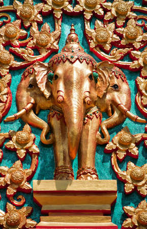 A detailed sculpture of elephants on a Thai buddhist temple in hua hin.の写真素材