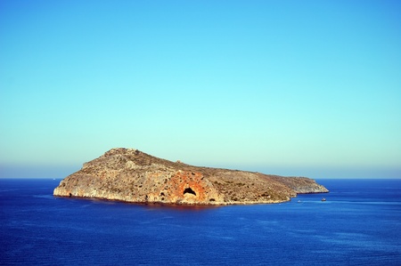The small island of Theodori Nisida as seen from the greek island of Crete.の写真素材
