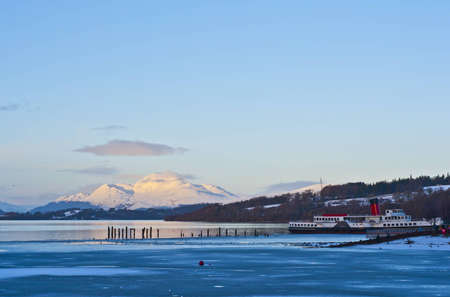 A view of loch lomond with paddle steamer in the foreground