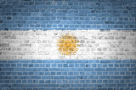 An image of the Argentina flag painted on a brick wall in an urban locationの写真素材
