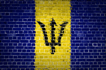 An image of the Barbados flag painted on a brick wall in an urban locationの写真素材