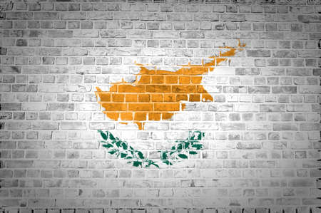 An image of the Cyprus flag painted on a brick wall in an urban locationの写真素材