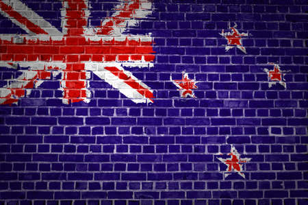 An image of the New Zealand flag painted on a brick wall in an urban locationの写真素材