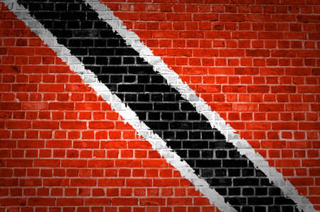 An image of the Trinidad and Tobago flag painted on a brick wall in an urban locationの写真素材