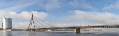 A panoramic image of the Vansu bridge that spans the river Daugava in the Latvian capital of Riga のeditorial素材