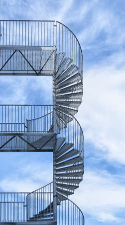 A typical metal fire escape on the side of a building の写真素材
