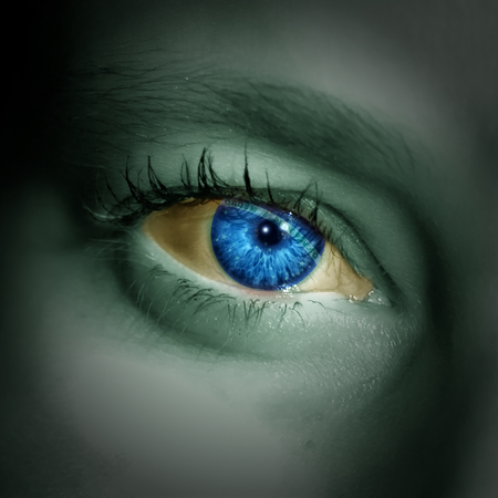 An image of a beautiful woman with the brazilian flag on her eye and face looking directly at you.の写真素材