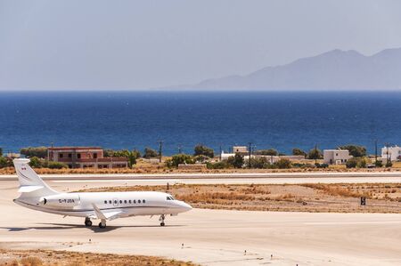 SANTORINI, GREECE - July 10, 2011: A private executive jet prepares to depart from International Airport 'Santorini', Greece.のeditorial素材