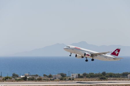 SANTORINI, GREECE - July 10, 2011: SWISS, swiss, a Lufthansa group airline and Star Alliance member, Airbus A320 aircraft departing from International Airport 'Santorini', Greece.のeditorial素材