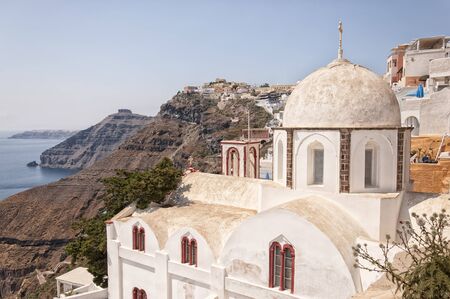 An image of the santorini capital town of fira with landmark church in the foreground.のeditorial素材