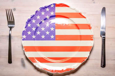 A flag concept of a dinner plate with the flag of The USA on it.の写真素材