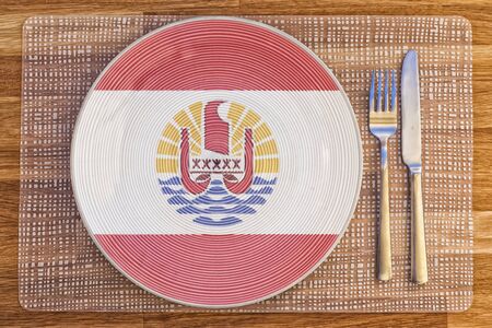 Dinner plate with the flag of French Polynesia on it for your international food and drink concepts.の写真素材