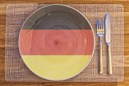 Dinner plate with the flag of Germany on it for your international food and drink concepts.の写真素材