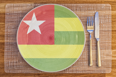 Dinner plate with the flag of Togo on it for your international food and drink concepts.の写真素材