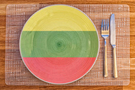 Dinner plate with the flag of Lithuania on it for your international food and drink concepts.の写真素材