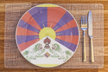 Dinner plate with the flag of Tibet on it for your international food and drink concepts.の写真素材