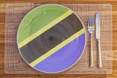 Dinner plate with the flag of Tanzania on it for your international food and drink concepts.の写真素材
