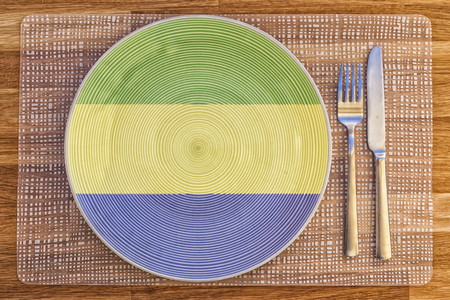 Dinner plate with the flag of Gabon on it for your international food and drink concepts.の写真素材