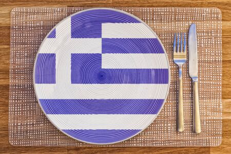 Dinner plate with the flag of Greece on it for your international food and drink concepts.の写真素材