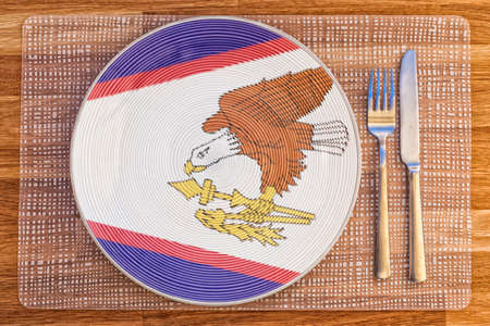 Dinner plate with the flag of American Samoa on it for your international food and drink concepts.の写真素材