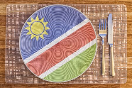 Dinner plate with the flag of Namibia on it for your international food and drink concepts.の写真素材