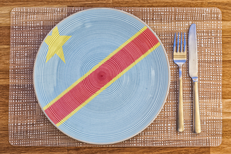 Dinner plate with the flag of Congo Kinshasa on it for your international food and drink concepts.の写真素材
