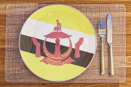 Dinner plate with the flag of Brunei on it for your international food and drink concepts.の写真素材