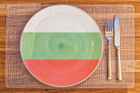 Dinner plate with the flag of Bulgaria on it for your international food and drink concepts.の写真素材