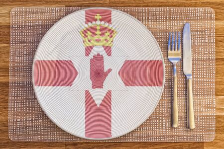 Dinner plate with the flag of Northern Ireland on it for your international food and drink concepts.の写真素材