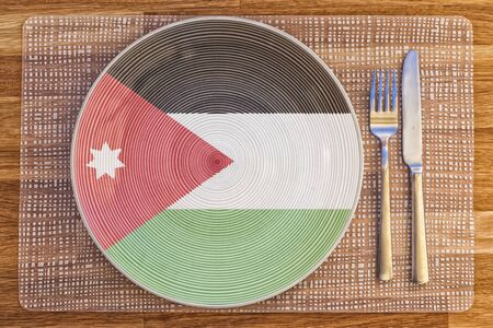 Dinner plate with the flag of Jordan on it for your international food and drink concepts.の写真素材