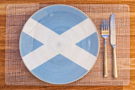Dinner plate with the flag of Scotland on it for your international food and drink concepts.の写真素材