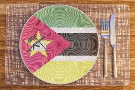 Dinner plate with the flag of Mozambique on it for your international food and drink concepts.の写真素材