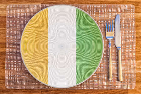 Dinner plate with the flag of Ivory Coast on it for your international food and drink concepts.の写真素材