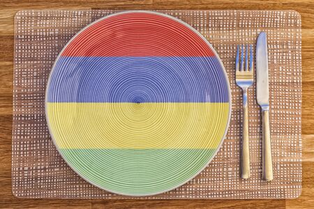Dinner plate with the flag of Mauritius on it for your international food and drink concepts.の写真素材