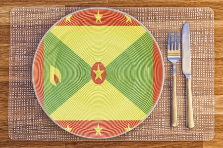 Dinner plate with the flag of Grenada on it for your international food and drink concepts.の写真素材