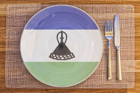 Dinner plate with the flag of Lesotho on it for your international food and drink concepts.の写真素材