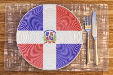 Dinner plate with the flag of Dominican Republic on it for your international food and drink concepts.の写真素材