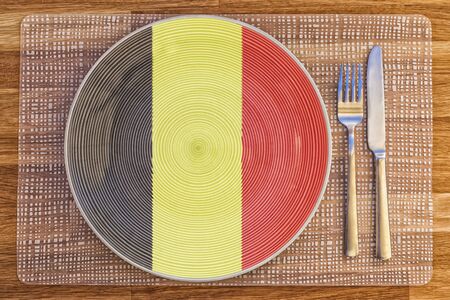 Dinner plate with the flag of Belgium on it for your international food and drink concepts.の写真素材