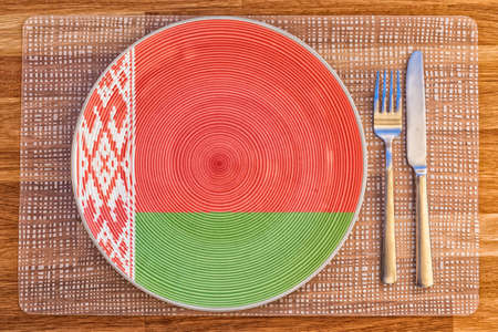 Dinner plate with the flag of Belarus on it for your international food and drink concepts.の写真素材