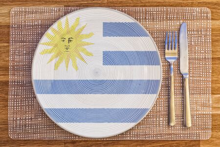 Dinner plate with the flag of Uruguay on it for your international food and drink concepts.の写真素材