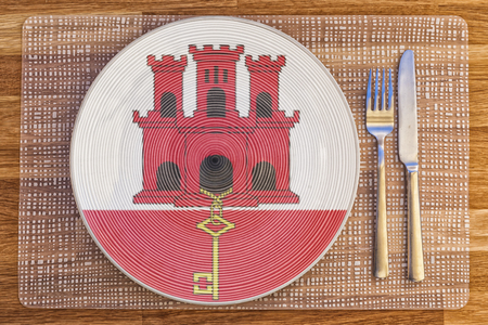 Dinner plate with the flag of Gibraltar on it for your international food and drink concepts.の写真素材