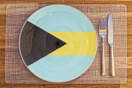 Dinner plate with the flag of the Bahamas on it for your international food and drink concepts.の写真素材